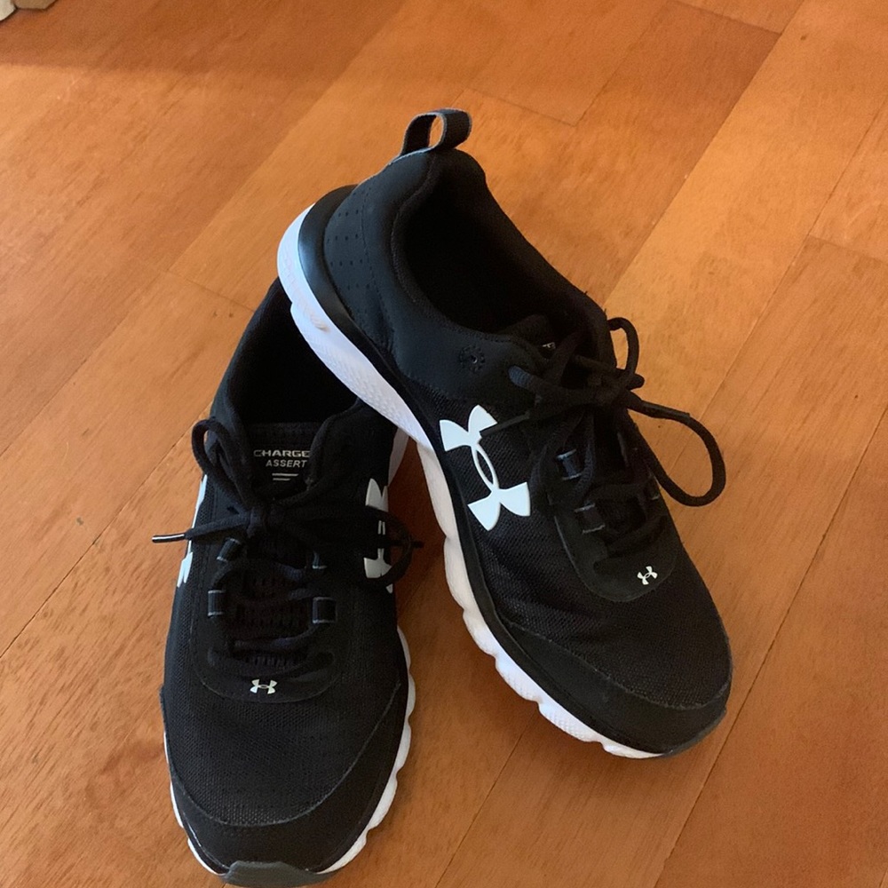 A pair of Under Armour Charged Asserts for women size 8.5. Been worn once.